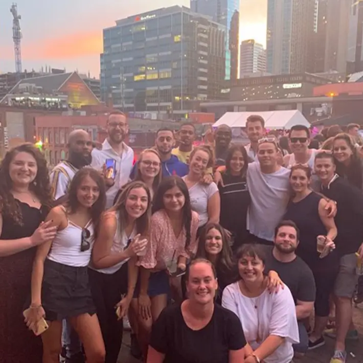 Group of friends at rooftop gathering.